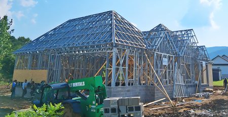 Modular steel construction site featuring cold formed steel frames and advanced steel framing machines for efficient and durable building solutions.